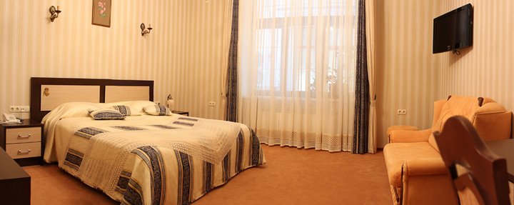 Standard room at the Cleopatra Hotel in Kamenets-Podilskyi. Book with a discount