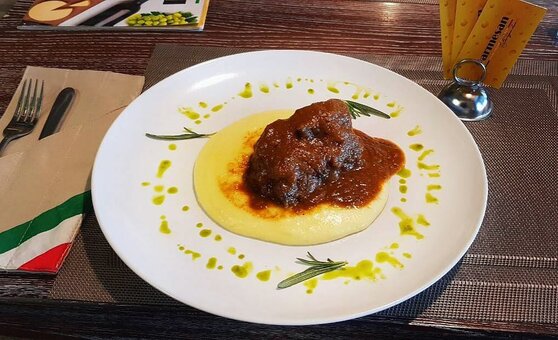 Promotion for italian cuisine in the parmesan restaurant in mariupol. book with a discount